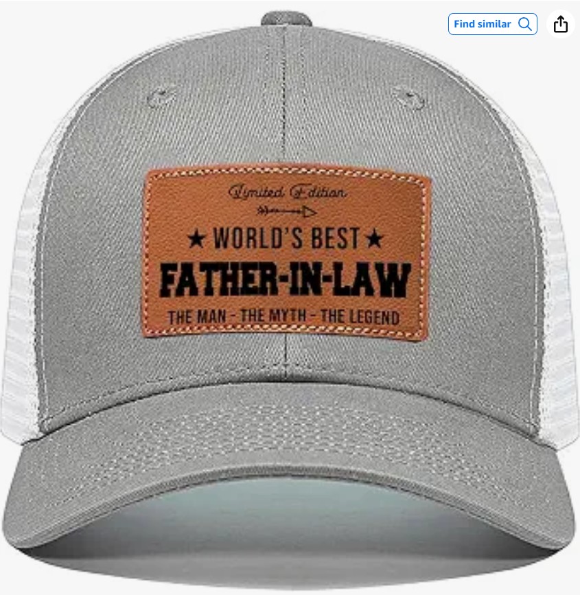 Grey and white trucker cap with a leather patch reading World's Best Father-in-Law, The Man, The Myth, The Legend