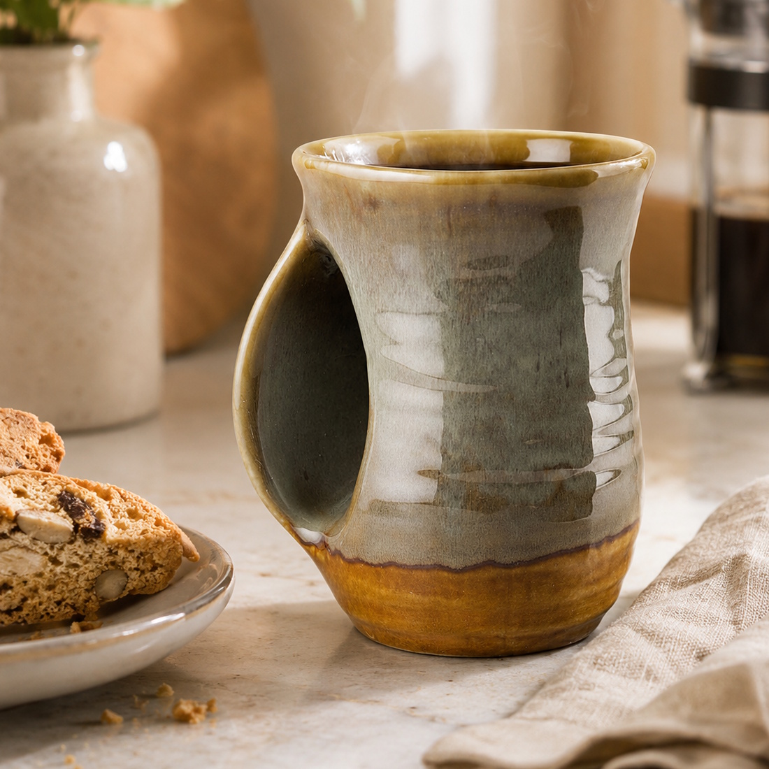 Artisan-style stoneware coffee mug gift for husband with earthy brown and gray reactive glaze and hand-warmer handle