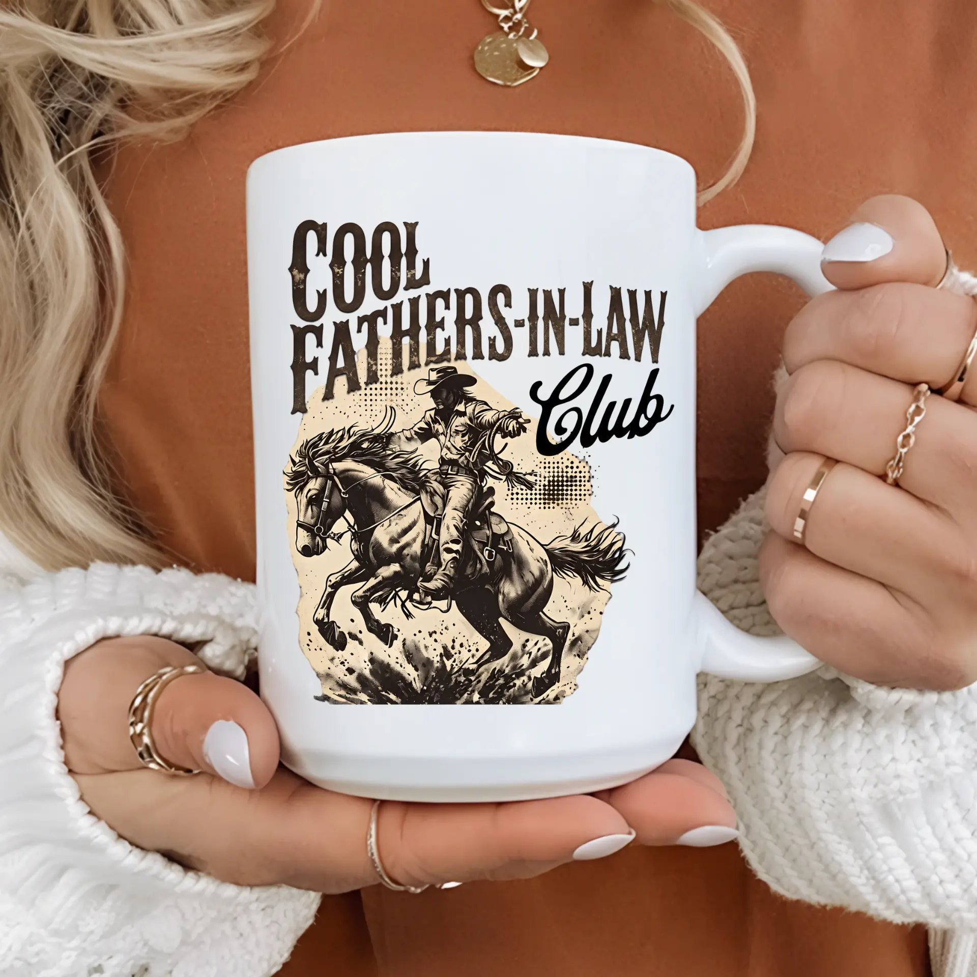 White ceramic mug printed with Cool Fathers-in-Law Club above a vintage-style illustration of a cowboy on a horse