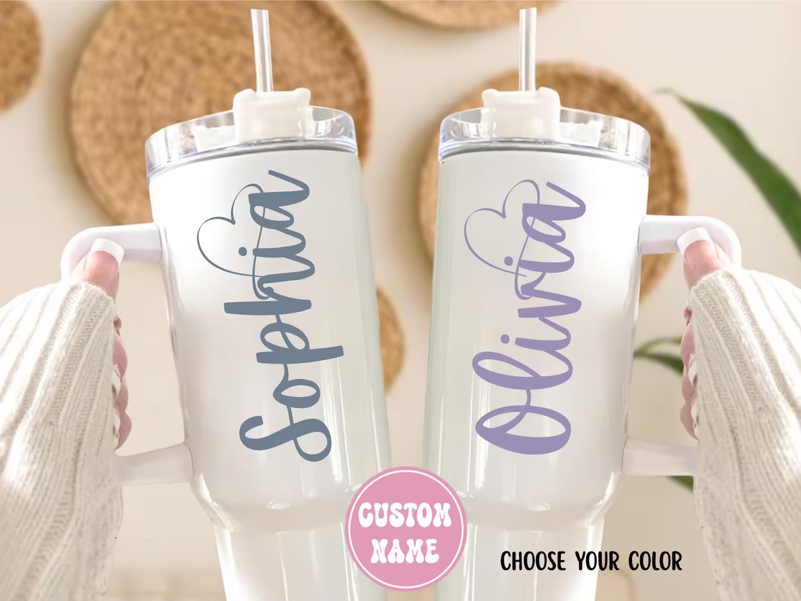 Two white personalized 40 oz teacher tumbler gifts with handle and straw, one with gray 'Sophia' script and one with lavender 'Olivia' script and heart accents