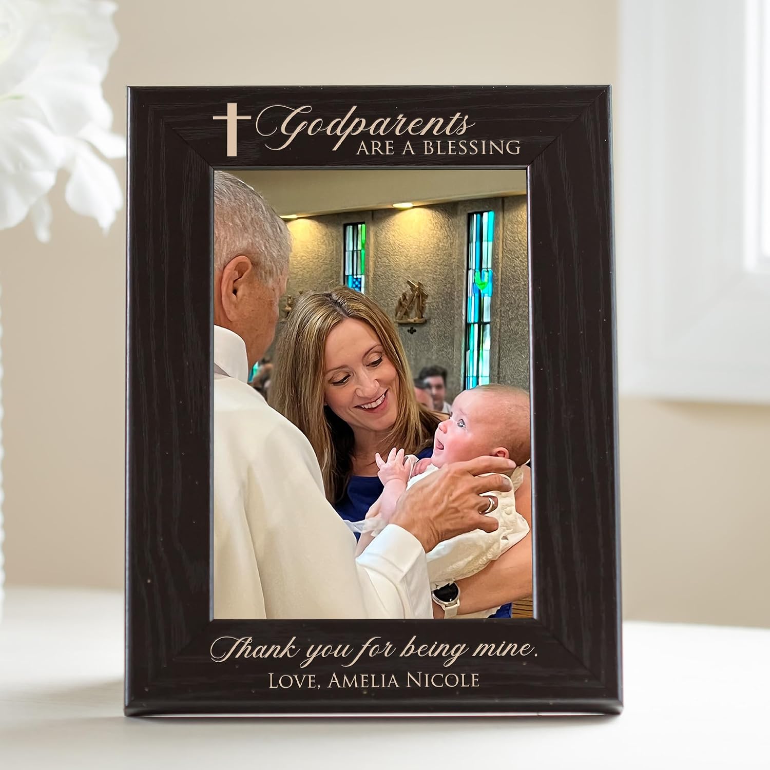 Dark solid-wood photo frame engraved with a cross and the words Godparents are a blessing above the photo and Thank you for being mine below it