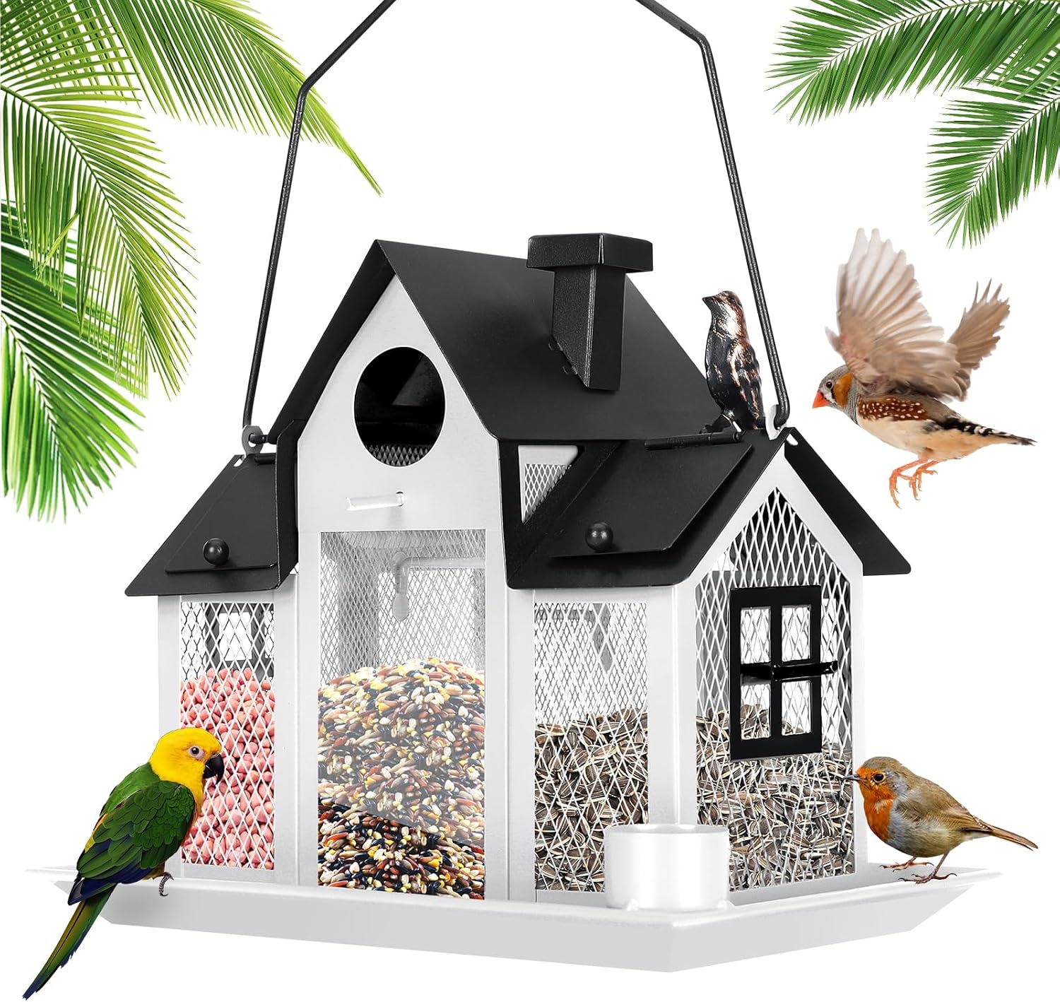 White and black cottage-shaped hanging bird feeder with mesh sides and multiple seed compartments, with birds perched on the tray