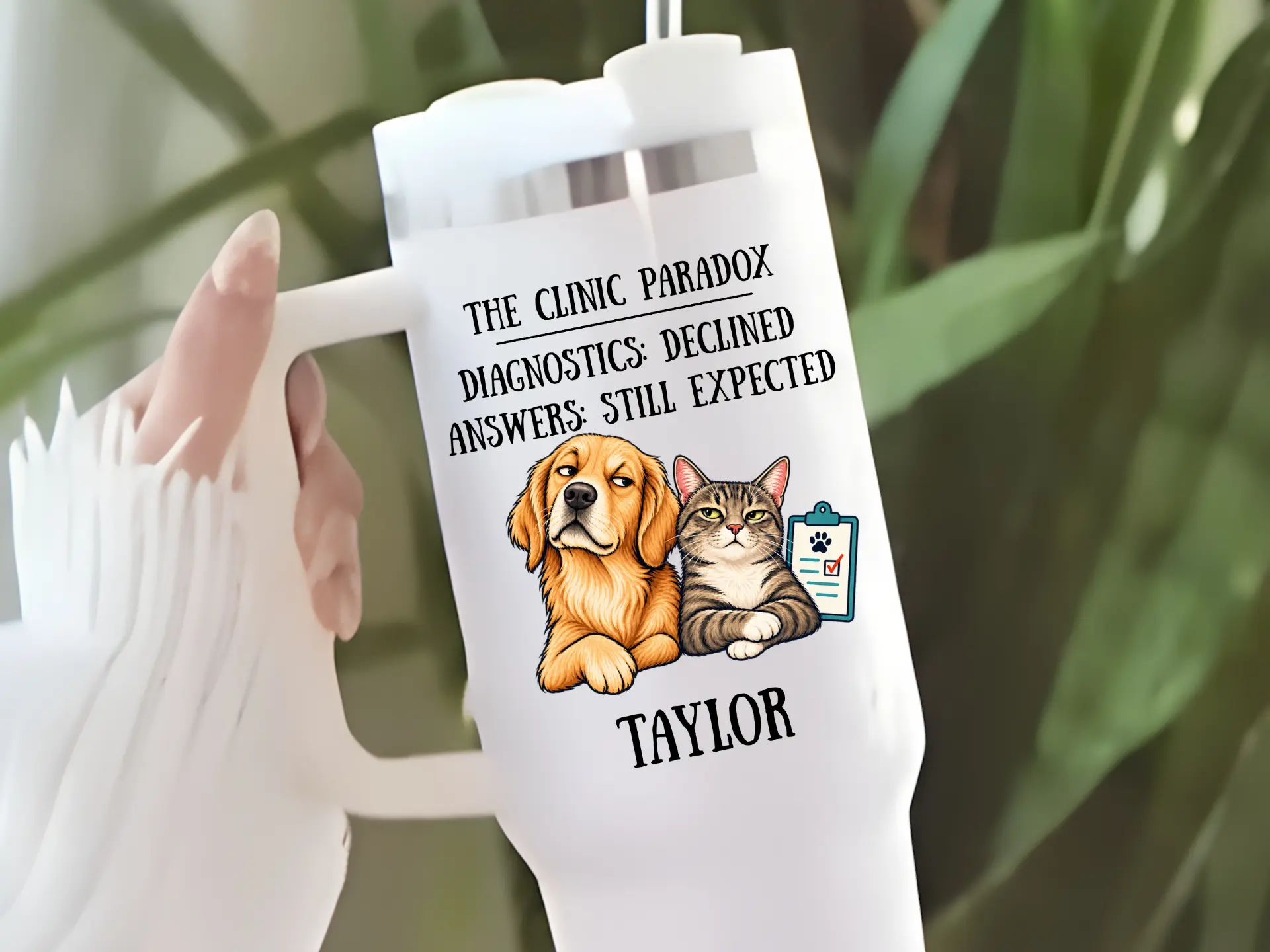 White 40 ounce handled tumbler with a straw, printed with The Clinic Paradox, a golden retriever and a tabby cat with a chart, and the name Taylor